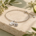 Feedogo concept visual of personalized pet bracelet with name and portrait charms